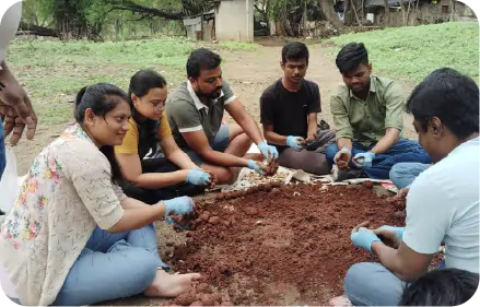 Team making seedballs during CSR driveShape 